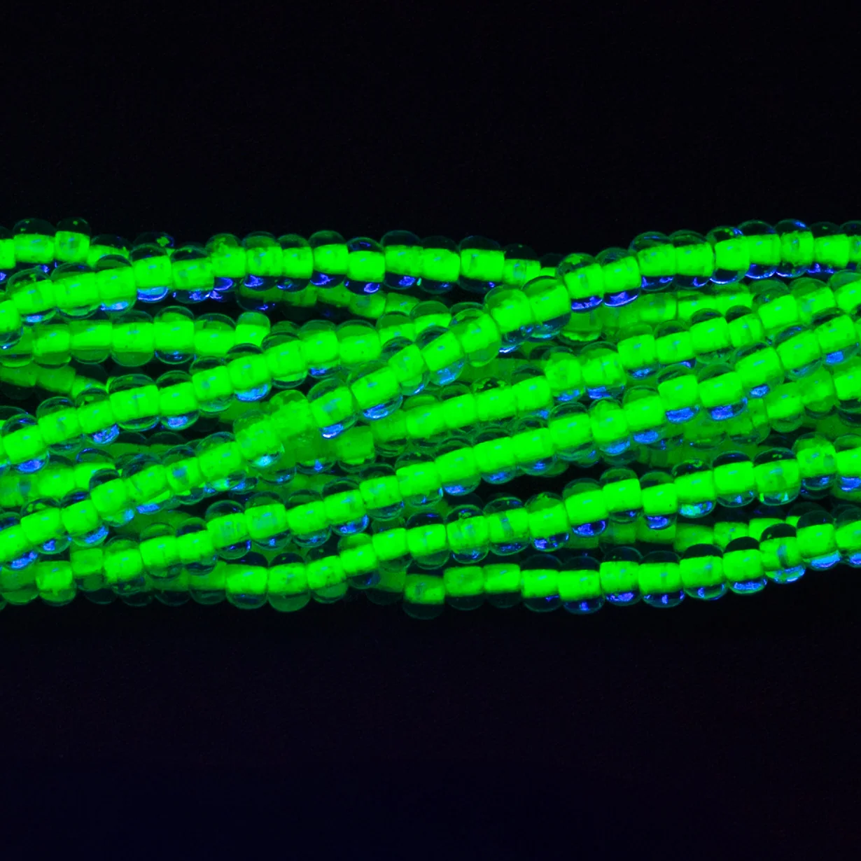 6SB784-NR: CZ Seed Bead Neon Lined Green 6/0 Uv Reactive-6STR - Image 2