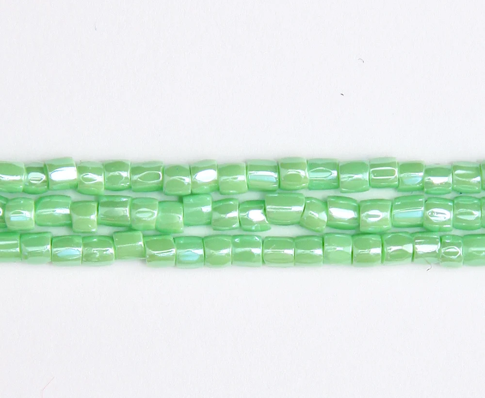 9SC381: CZ Seed Bead 3-cut LT Green Luster 9/0 5HK