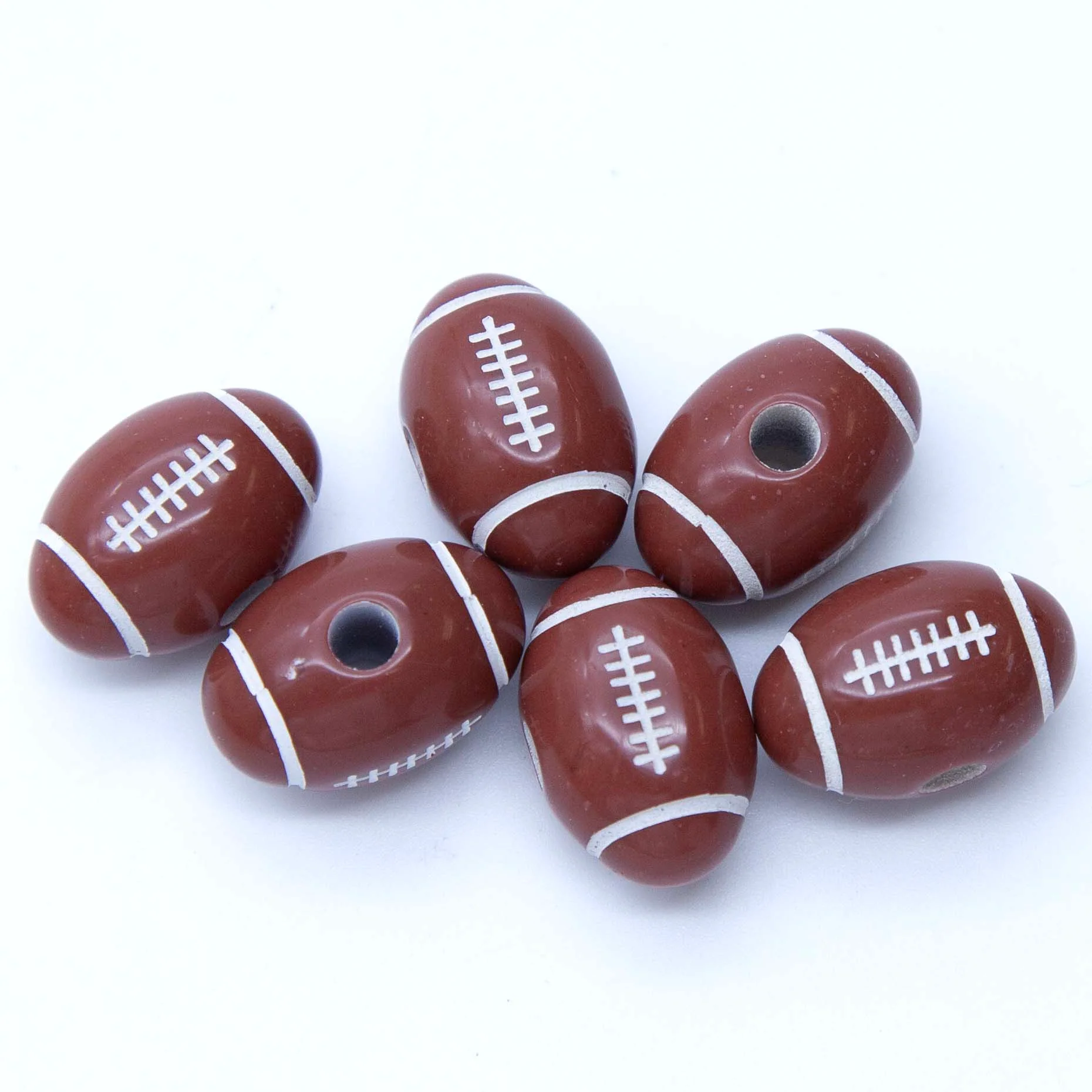 PL204: Acrylic Football/Rugby Ball 12x19mm 300Pc